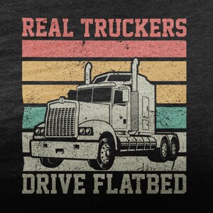 May include: A vintage-style graphic design featuring a white semi-truck with the text "REAL TRUCKERS DRIVE FLATBED" in black letters. The background is a faded rainbow of pink, orange, yellow, and blue.