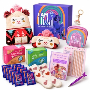 May include: A puberty starter kit featuring a purple box labeled I AM Eli & Val, a plush llama, a sleep mask, a zippered pouch, Lady Hero sanitary pads and panty liners, feminine wipes, heart-patterned socks, a period tracker, and a purple pen.