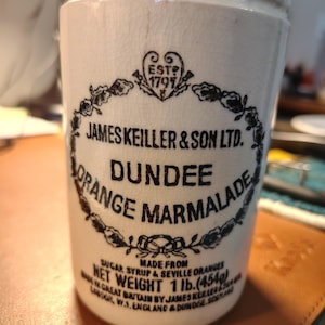 May include: A set of three ceramic mugs with a speckled, matte finish. The mugs are in shades of cream, light gray, and dark gray. Each mug has a simple, minimalist design, perfect for coffee or tea.
