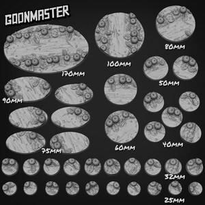 May include: A collection of grey miniature bases labeled GOONMASTER, featuring textured surfaces with sculpted leaves and spherical fruit. Sizes include 25mm, 32mm, 40mm, 50mm, 60mm, 75mm, 80mm, 90mm, 100mm, and 170mm, displayed in various circular and oval shapes.