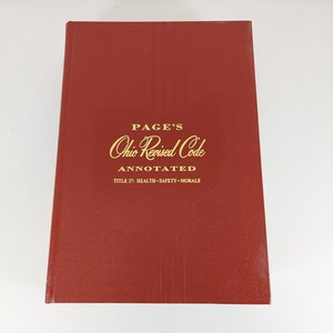 May include: A red hardcover book with the title "PAGE'S Ohio Revised Code ANNOTATED TITLE 37: HEALTH-SAFETY-MORALS" in gold lettering.