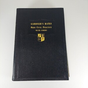 May include: A black hardcover book with gold lettering on the front cover. The title is "GARDNER'S BATES Ohio Civil Practice WITH FORMS". A gold crest with a quill pen, scales of justice, and a tree is in the center of the cover.
