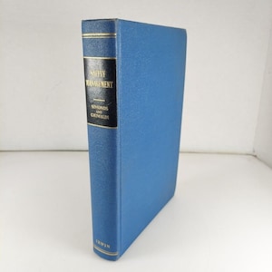 May include: A blue hardcover book titled "Safety Management" by Simonds and Grimaldi. The book is published by Irwin.