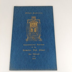 May include: A blue booklet with gold lettering announcing the commencement exercises of Coshocton High School, celebrating its fiftieth anniversary on June thirteenth, 1929.