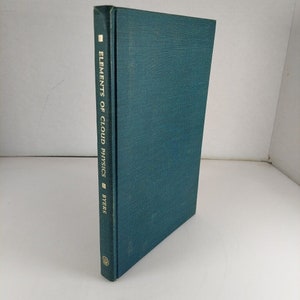 May include: A teal blue hardcover book with the title "Elements of Cloud Physics" by "Byers" printed in gold lettering on the spine.
