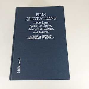 May include: A dark blue hardback book titled "Film Quotations" with the subtitle "11,000 Lines Spoken on Screen, Arranged by Subject, and Indexed". The authors are Robert A. Nowlan and Gwendolyn W. Nowlan. The book is published by McFarland.