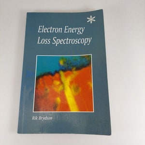 May include: A blue book with the title "Electron Energy Loss Spectroscopy" and a snowflake symbol. The cover features an abstract image of a colorful, blurred landscape.