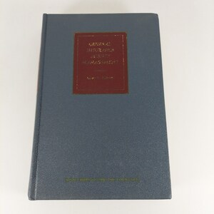Puede incluir: Un libro de tapa dura azul con lomo rojo y letras doradas. El título es "General Insurance Agency Management".