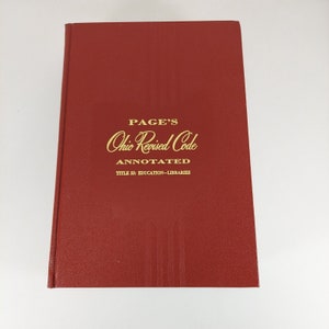 May include: A red hardcover book titled "PAGE'S Ohio Revised Code ANNOTATED TITLE 33: EDUCATION-LIBRARIES".