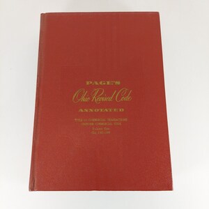 May include: A red hardcover book titled "PAGE'S Ohio Revised Code ANNOTATED TITLE 15: COMMERCIAL TRANSACTIONS UNIFORM COMMERCIAL CODE Volume One Chs 1301-1309"
