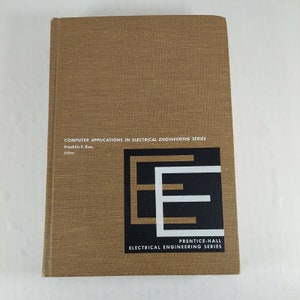 May include: A brown book with the title "Computer Applications in Electrical Engineering Series" and the text "Prentice-Hall Electrical Engineering Series".