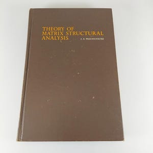 May include: A brown hardcover book titled "THEORY OF MATRIX STRUCTURAL ANALYSIS" by J.S. Przemieniecki. The book has a simple, clean design with the title in gold lettering.