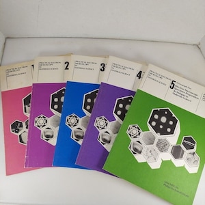 May include: A collection of five books titled "Practical Electron Microscopy in Materials Science." The books have colorful covers in pink, purple, blue, and green. Each cover features a geometric design with scientific illustrations and the Macmillan Philips Technical Library logo.