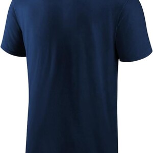 May include: A navy blue short-sleeved t-shirt. The shirt has a crew neck and a simple, classic design. The fabric appears to be soft and comfortable, suitable for casual wear.