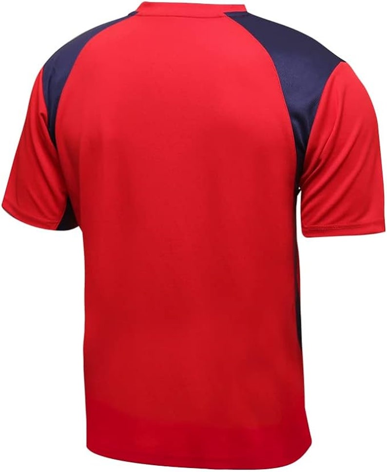 May include: Red and navy blue short-sleeved athletic shirt. The shirt has a navy blue color block on the shoulders and sleeves.