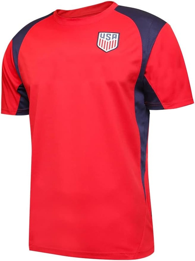 May include: Red short-sleeved t-shirt with navy blue accents on the sleeves and shoulders. The shirt features a white and blue USA logo on the chest.
