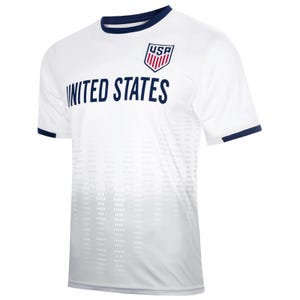 May include: White soccer jersey with a navy blue collar and sleeve trim. The jersey has a white and gray gradient pattern and features the text "UNITED STATES" and a red, white, and blue "USA" logo.