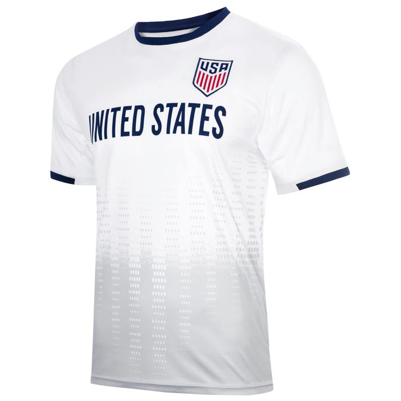 May include: White soccer jersey with a navy blue collar and sleeve trim. The jersey has a white and gray gradient pattern and features the text "UNITED STATES" and a red, white, and blue "USA" logo.