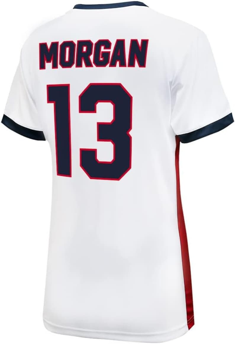 May include: White football shirt with red and blue trim. The back of the shirt has the name "MORGAN" and the number "13" in navy blue with red outlines.