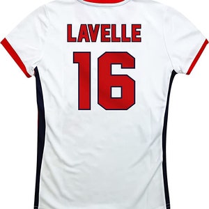 May include: White jersey with red and blue trim. The back of the jersey has the name "LAVELLE" and the number "16" in red with a blue outline.