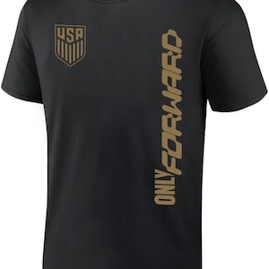 May include: Black t-shirt with a gold USA crest on the left chest and the words "ONLY FORWARD" vertically down the right side.