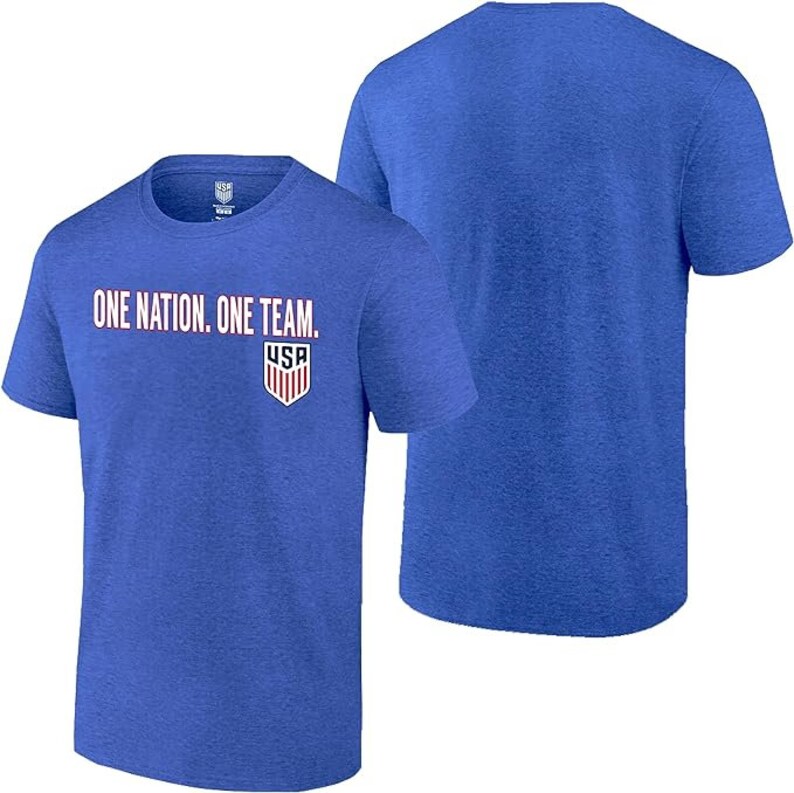 May include: A royal blue t-shirt with the words "One Nation. One Team." printed in white and red on the front. A small USA logo is printed below the text. The back of the shirt is plain.