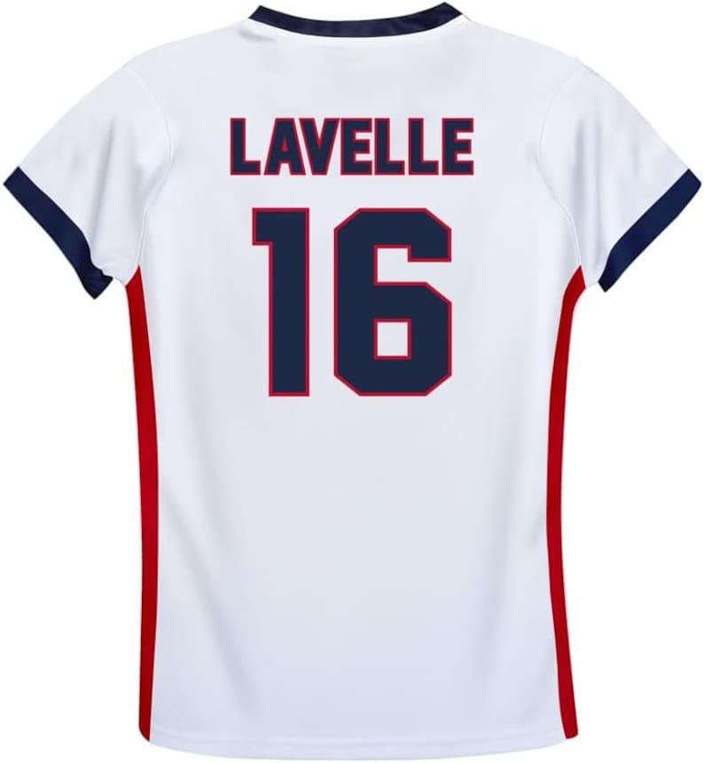 May include: White soccer jersey with red and blue trim. The back of the jersey has the name "LAVELLE" and the number "16" in navy blue with red outlines.