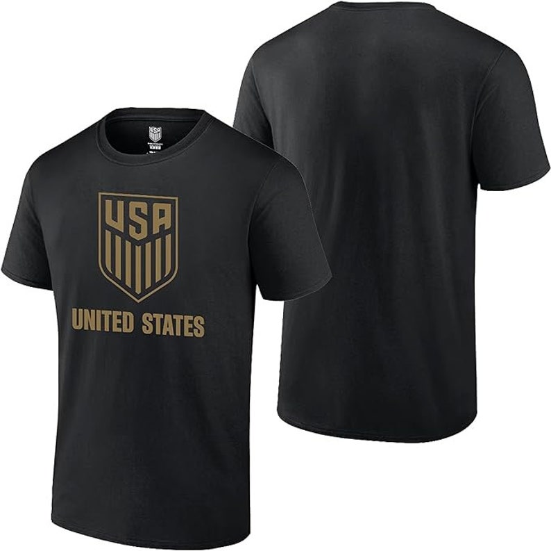 May include: Black t-shirt with a gold "USA" crest and "UNITED STATES" text.