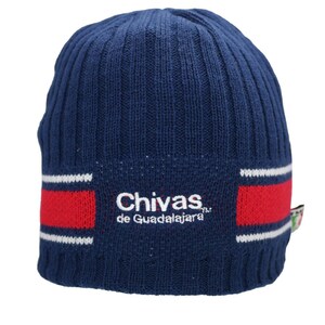 May include: A blue knitted beanie with a red and white stripe and the embroidered text "Chivas de Guadalajara" in white.