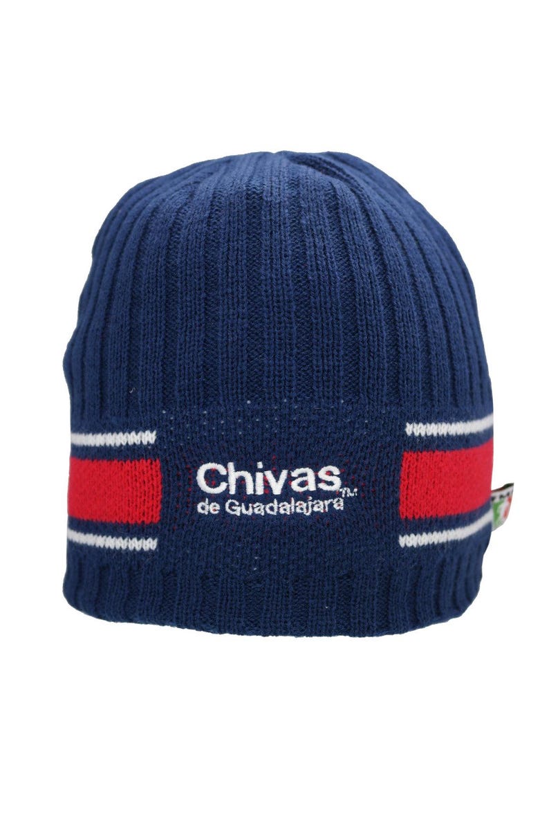 May include: A blue knitted beanie with a red and white stripe and the embroidered text "Chivas de Guadalajara" in white.
