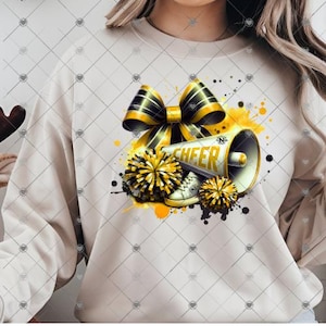 May include: A white sweatshirt with a black and gold bow, pom-poms, and a megaphone with the word "CHEER" on it. The design is on a white background with yellow and black splatters.