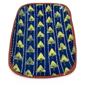 May include: A handmade, ceramic serving tray with a dark blue background. The tray features a repeating pattern of yellow triangles and white dotted lines. The rim is a reddish-brown color.