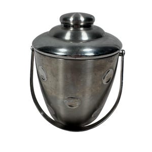 May include: A stainless steel ice bucket with a lid and handle. The bucket has a rounded shape with a series of circular indentations. The handle is a curved metal bar. The lid has a small, round knob.