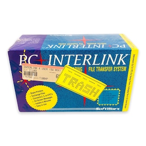 May include: A rectangular box for PC Interlink software. The box is primarily blue and purple with the words "PC INTERLINK" in large white letters. It includes text about sharing printers and exchanging files.