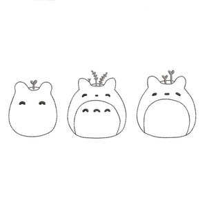 May include: Three white ceramic planters shaped like cartoon characters with small plants growing out of the top.
