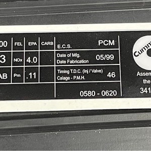 May include: A black and white engine information label with the text "SIGNATURE 600" and "14027823". The label also includes the text "Cummins" and "Assembled in the USA".