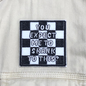 May include: Black and white checkered iron-on patch with the text "YOU EXPECT ME TO SKANK TO THIS?"