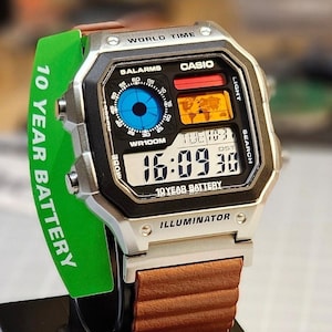 Custom Casio AE-1200 Watch: Silver Case,Saddle brown Leatherette Magnetic Strap, Colored LCD