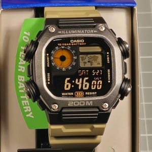 Modified watch based on Casio AE-1200. DW-291 &#39;desert&#39; case and strap plus colorized LCD.