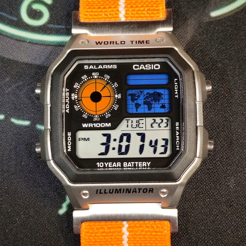 Custom Casio AE-1200 Watch: Silver Case, Orange Elastic Strap
