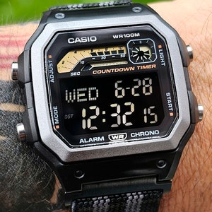 Modified watch based on Casio WS-1600, half negative polarised LCD, hydromod case and Bond theme aftermarket elastic 22mm strap.