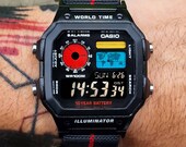 Modified Casio AE-1200, colorful polarised LCD, hydromod case and black French style elastic nato band.