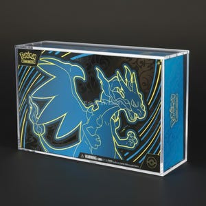 May include: A clear acrylic box featuring a blue and yellow graphic of a dragon. The box has a black background with the Pokemon logo and text. The box is designed to hold collectible cards or other items.