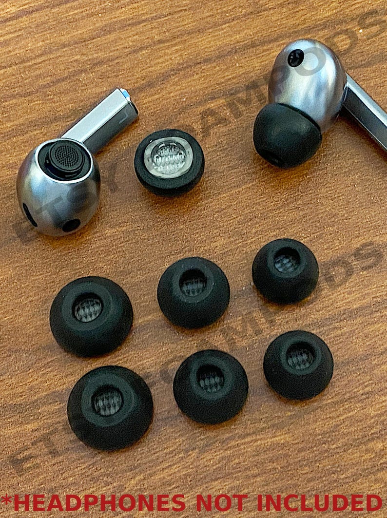 May include: A set of eight black silicone earbud tips for headphones. The tips are of varying sizes and have a small mesh opening in the center.  *HEADPHONES NOT INCLUDED*