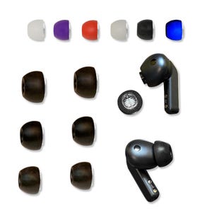 May include: An assortment of replacement ear tips in various colors, including white, purple, red, black, and blue, alongside black wireless earbuds. The ear tips are made of soft silicone and come in different sizes. The earbuds are black and have a sleek design.