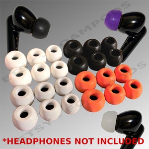 May include: A set of 18 replacement ear tips for headphones in white, black, and orange. The ear tips are made of silicone and come in a variety of sizes. *Headphones not included*.