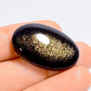 Obsidiana natural dourada com brilho oval, cabochão, pedra preciosa solta para fazer joias, 27 ct. 30 x 19 x 5 mm (pedra conforme a imagem)