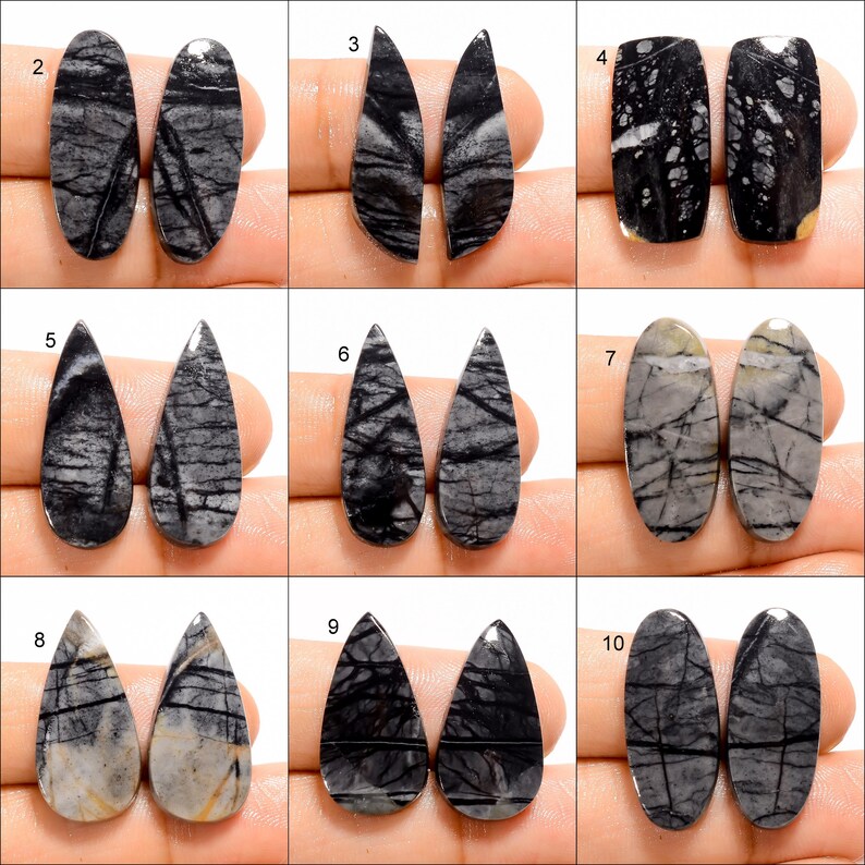 May include: Ten pairs of black and white stone cabochons in various shapes, including oval, teardrop, and pear. The stones have a natural, marbled pattern.