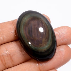 Cabochão de obsidiana natural em formato oval, pedra preciosa para fazer joias, 64 ct. 35 x 23 x 11 mm (pedra conforme a imagem)