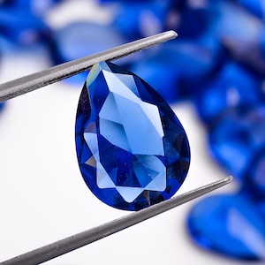 Cristalli di vetro tagliato con zaffiro blu a forma di goccia con punta posteriore Pietre per la creazione di gioielli Dimensioni 10 x 14 mm (pietra come da foto)